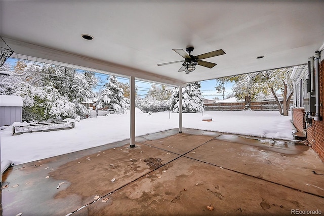 snow covered patio with ceiling fan