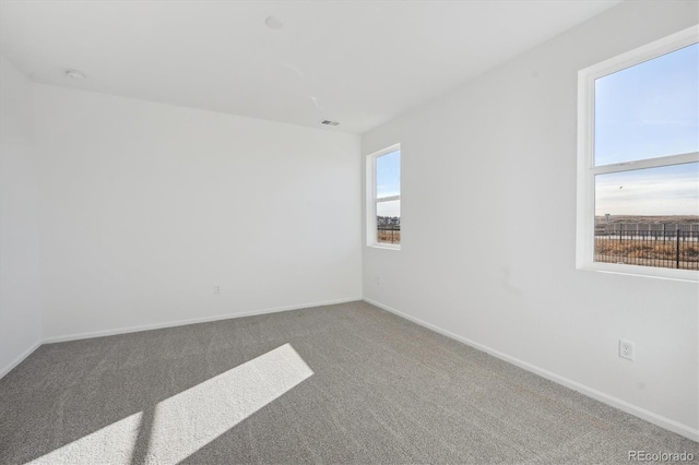 empty room with carpet flooring