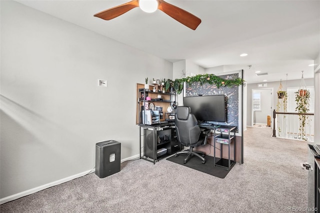 office space with carpet and ceiling fan