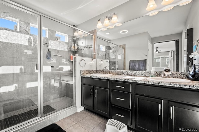 bathroom with vanity, tile patterned floors, an enclosed shower, and ceiling fan