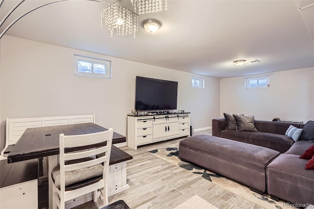 living room featuring plenty of natural light and light wood-type flooring