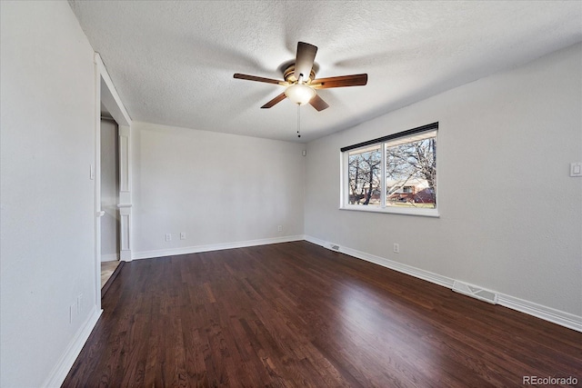 unfurnished room featuring ceiling fan, dark hardwood / wood-style flooring, and a textured ceiling