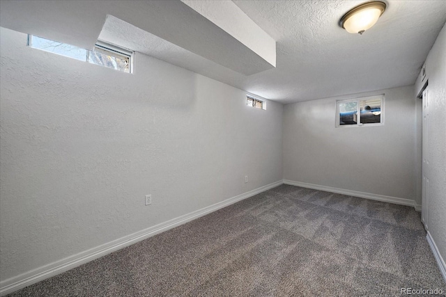 basement with carpet floors and a textured ceiling