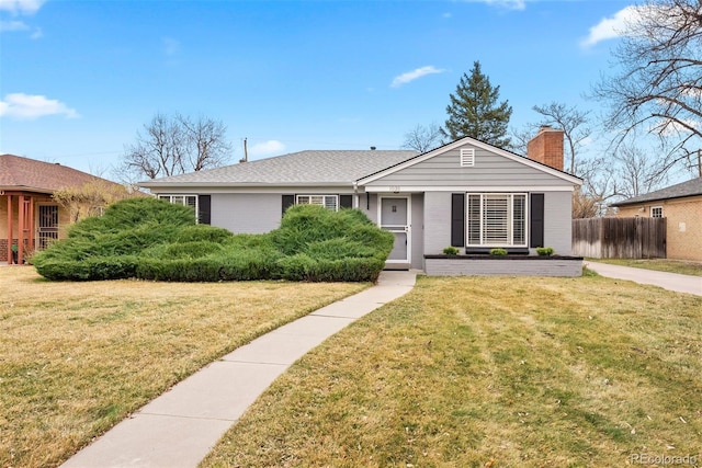 1030 Krameria St, Denver, CO 80220 - single story home featuring a chimney and brick siding