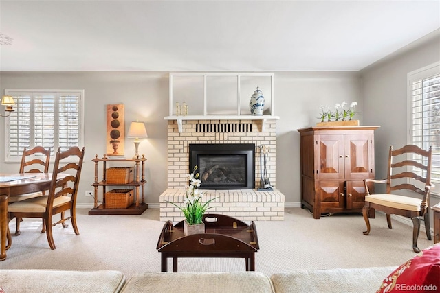 1030 Krameria St, Denver, CO 80220 - carpeted living area featuring a brick fireplace and baseboards