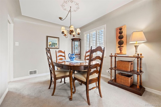 1030 Krameria St, Denver, CO 80220 - dining space with a chandelier, carpet, and baseboards