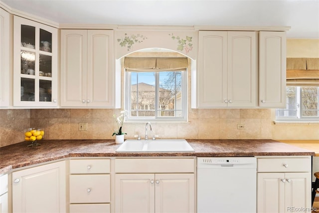 1030 Krameria St, Denver, CO 80220 - kitchen featuring white dishwasher, a sink, glass insert cabinets, and dark countertops