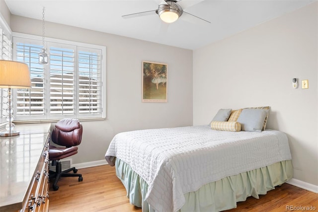 1030 Krameria St, Denver, CO 80220 - bedroom featuring wood finished floors, baseboards, and a ceiling fan