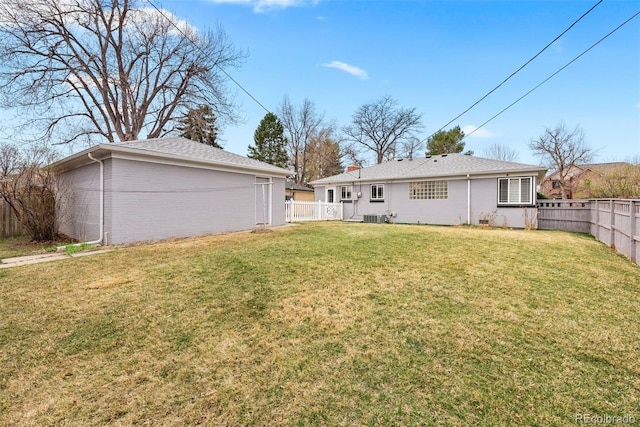 1030 Krameria St, Denver, CO 80220 - rear view of house featuring central AC unit, an outbuilding, and brick siding