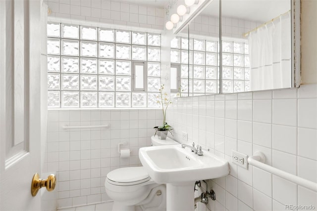 1030 Krameria St, Denver, CO 80220 - bathroom with toilet, tile walls, and a shower with shower curtain