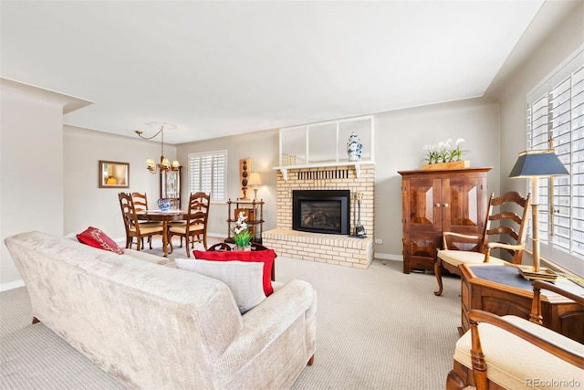1030 Krameria St, Denver, CO 80220 - living room featuring carpet, a chandelier, baseboards, and a brick fireplace