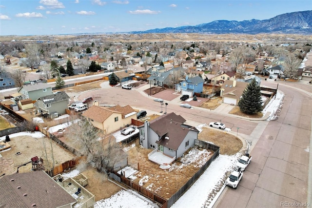 birds eye view of property with a mountain view