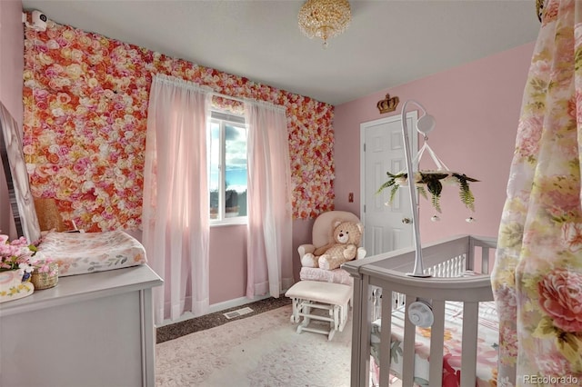 bedroom with a nursery area