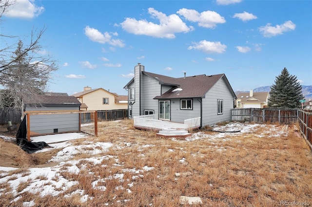 snow covered property featuring a deck