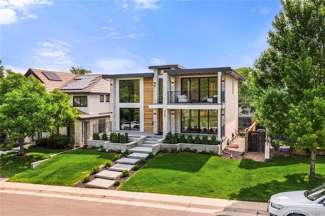 220 Glencoe St, Denver, CO 80220 - contemporary house with a balcony, a front lawn, and stone siding