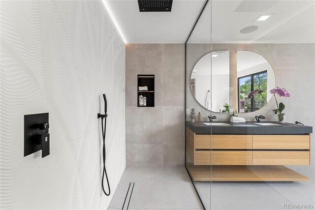 220 Glencoe St, Denver, CO 80220 - bathroom with double vanity, tile patterned flooring, and tile walls