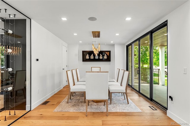220 Glencoe St, Denver, CO 80220 - dining space featuring light wood-style flooring, a chandelier, baseboards, and recessed lighting