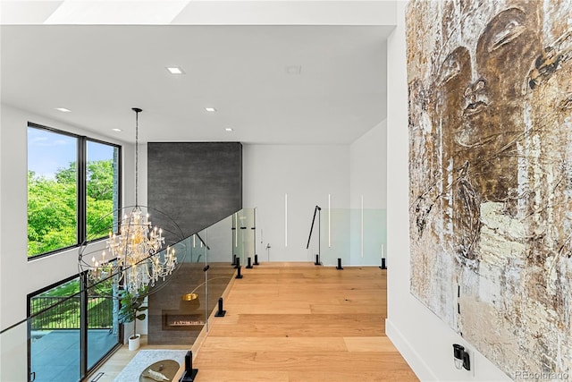 220 Glencoe St, Denver, CO 80220 - corridor with wood finished floors, a chandelier, plenty of natural light, and recessed lighting