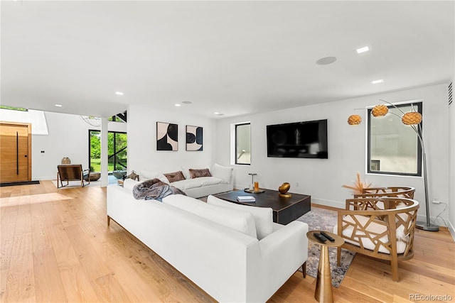 220 Glencoe St, Denver, CO 80220 - living area with light wood-style flooring, recessed lighting, and baseboards