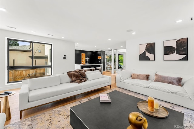 220 Glencoe St, Denver, CO 80220 - living area featuring wood finished floors and recessed lighting