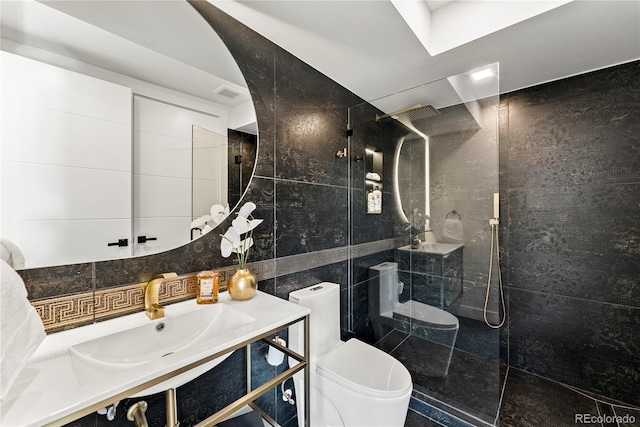 220 Glencoe St, Denver, CO 80220 - full bath with tile walls, toilet, walk in shower, vanity, and backsplash