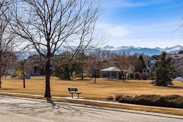 view of community featuring a gazebo, a yard, and a mountain view