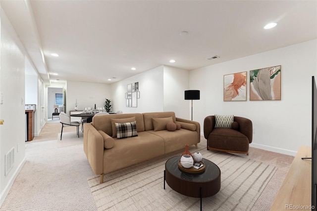 living room featuring visible vents, recessed lighting, and baseboards