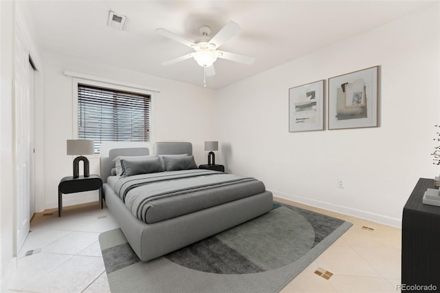 bedroom with light tile patterned flooring, baseboards, and visible vents