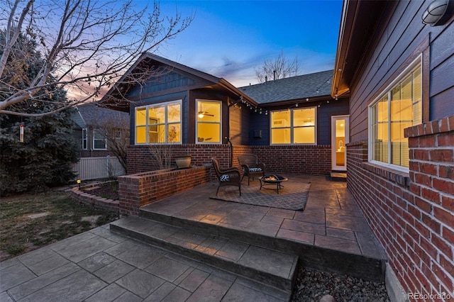 view of patio / terrace featuring a fire pit