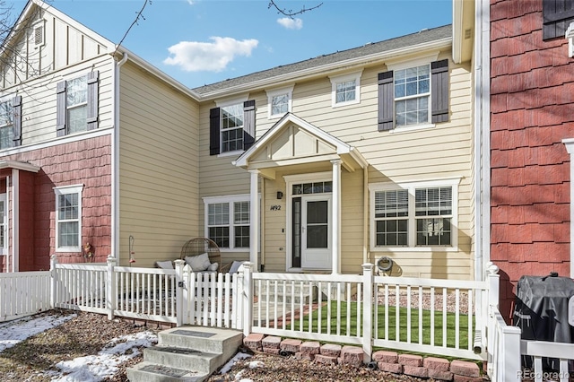 multi unit property with a porch and fence