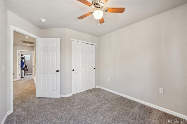 unfurnished bedroom with ceiling fan, carpet floors, visible vents, baseboards, and a closet