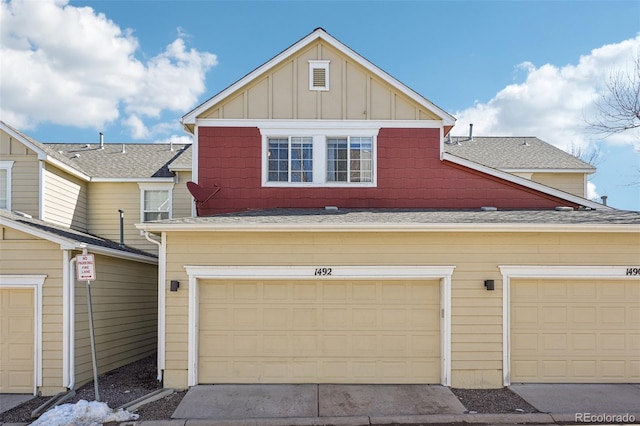 garage with concrete driveway