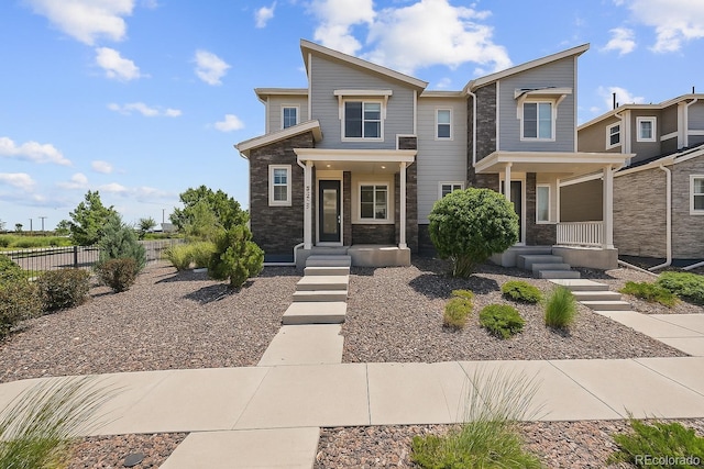 23633 E 5th Dr, Aurora, CO 80018 - view of front of property with stone siding and covered porch