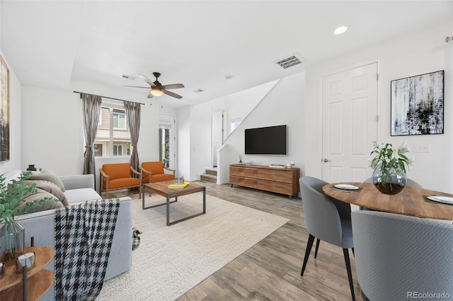 23633 E 5th Dr, Aurora, CO 80018 - living area featuring a ceiling fan, wood finished floors, recessed lighting, and stairway