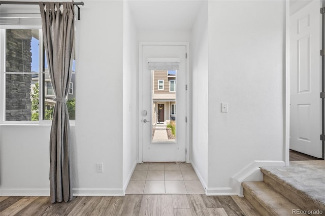 23633 E 5th Dr, Aurora, CO 80018 - entrance foyer featuring healthy amount of natural light and light wood-type flooring