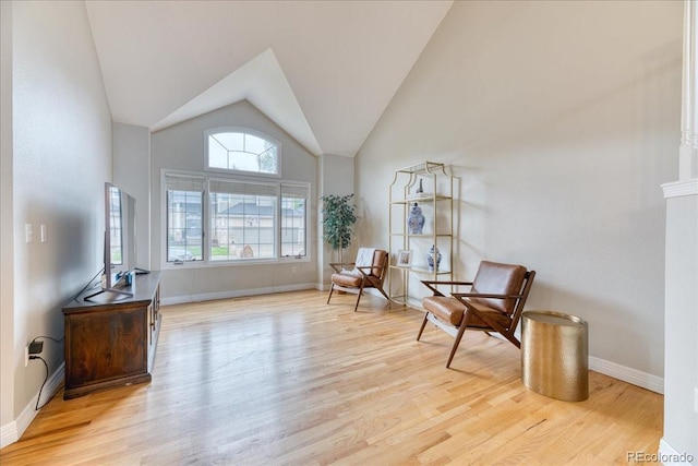 58 Rogers Ct, Golden, CO 80401 - living area with wood finished floors, vaulted ceiling, and baseboards