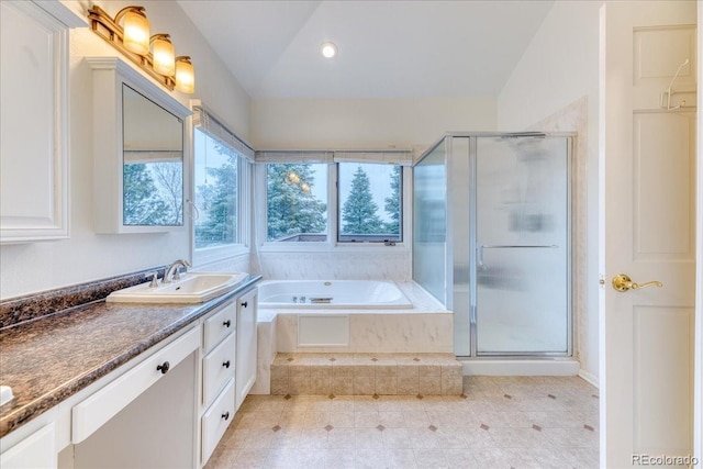 58 Rogers Ct, Golden, CO 80401 - full bath featuring vanity, a shower stall, a garden tub, tile patterned flooring, and recessed lighting