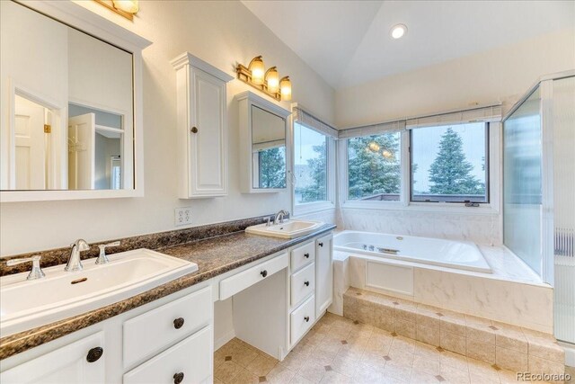 58 Rogers Ct, Golden, CO 80401 - bathroom with double vanity, a bath, tile patterned floors, and lofted ceiling