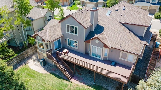 58 Rogers Ct, Golden, CO 80401 - back of house featuring a deck, a chimney, roof with shingles, and a residential view
