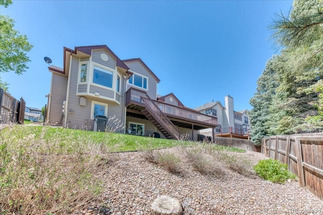 58 Rogers Ct, Golden, CO 80401 - back of property with stairs, a deck, and fence