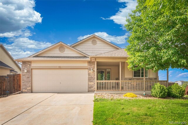 8617 W 17th Street Dr, Greeley, CO 80634 - single story home featuring concrete driveway, an attached garage, a porch, and roof with shingles