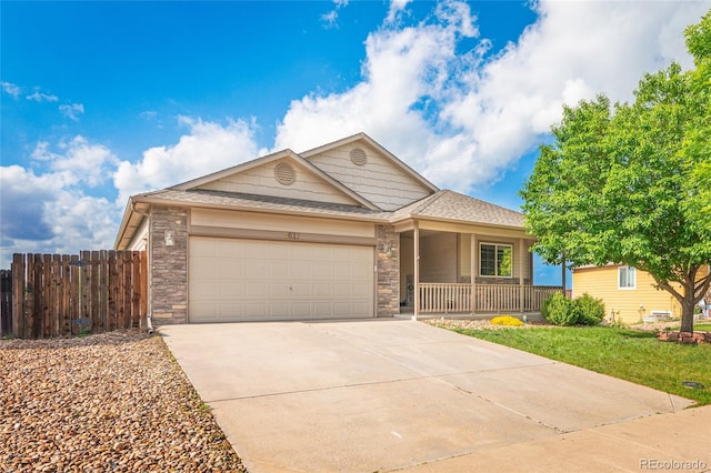 8617 W 17th Street Dr, Greeley, CO 80634 - single story home featuring a garage, driveway, a porch, a shingled roof, and stone siding