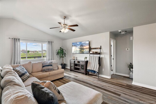 8617 W 17th Street Dr, Greeley, CO 80634 - living area with lofted ceiling, wood finished floors, a ceiling fan, and baseboards