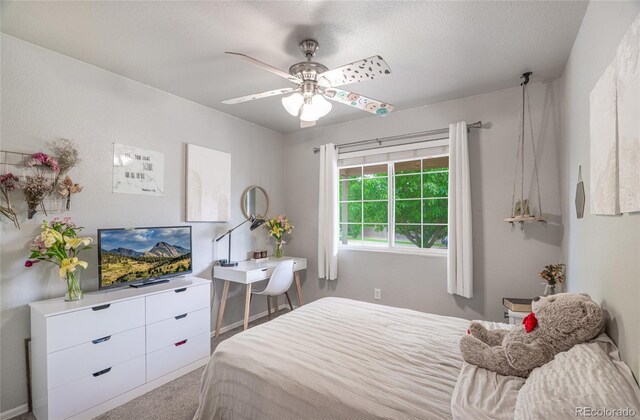 8617 W 17th Street Dr, Greeley, CO 80634 - carpeted bedroom featuring ceiling fan