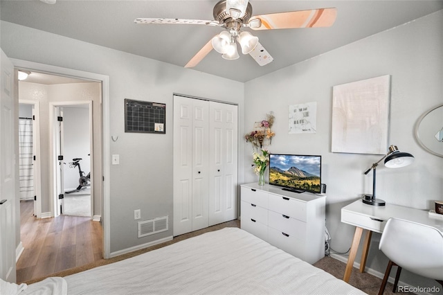 8617 W 17th Street Dr, Greeley, CO 80634 - bedroom with baseboards, a closet, ceiling fan, and wood finished floors