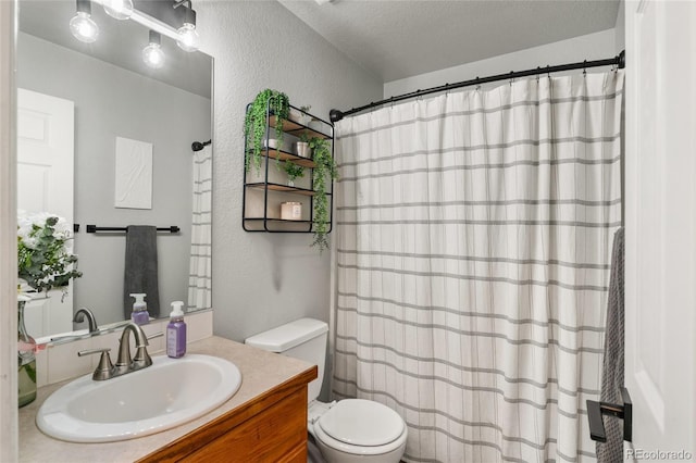 8617 W 17th Street Dr, Greeley, CO 80634 - full bath featuring toilet, vanity, a textured wall, a shower with shower curtain, and a textured ceiling
