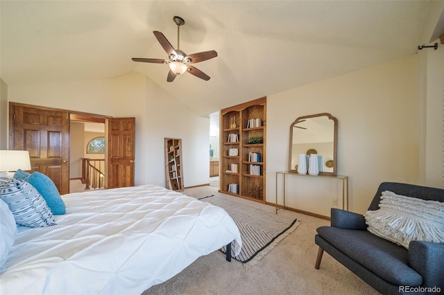 bedroom with ceiling fan, light colored carpet, and lofted ceiling