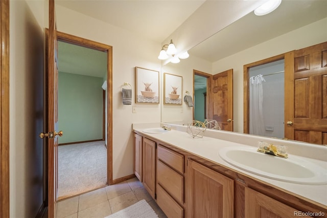 bathroom with tile patterned floors and vanity