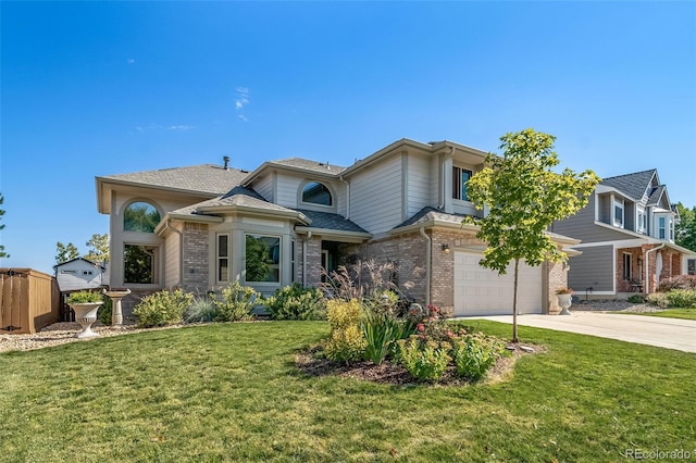 view of front of home featuring a front yard and a garage