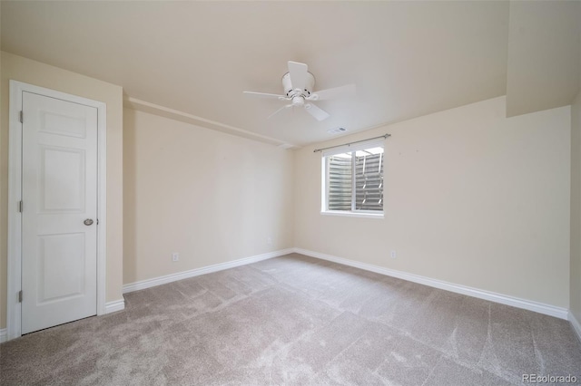 carpeted empty room with ceiling fan